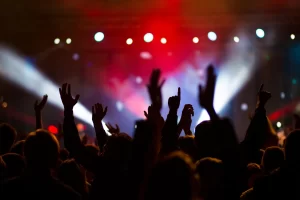 Crowd dancing under club lights in Ibiza – Ibiza Summer Club Tickets 2025