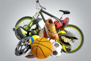 Various sports equipment including bicycle, helmet, roller skates, and balls for Touribisport at Sports Event Ibiza 2025